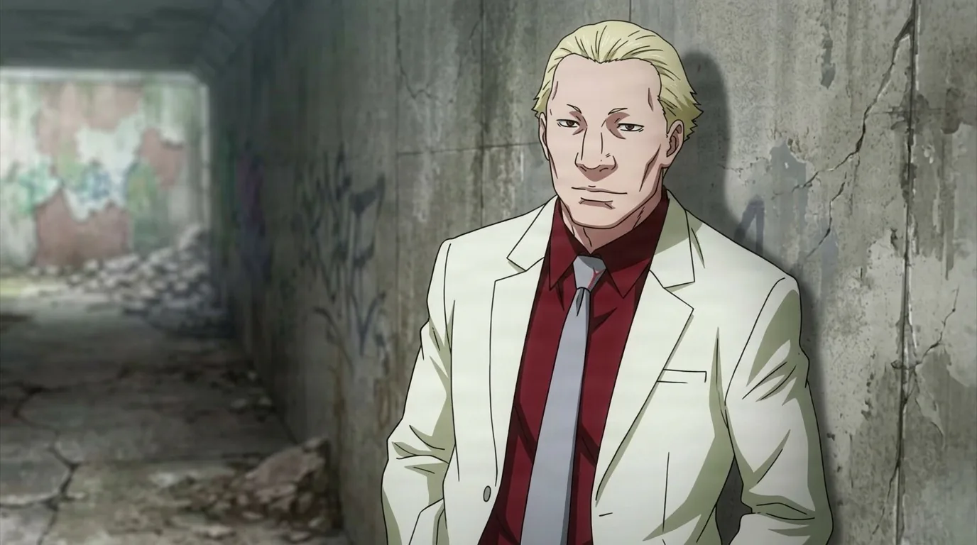 Yakumo Oomori in a white suit over a dark red shirt and grey tie, leaning against a cracked graffiti-covered wall in a tunnel